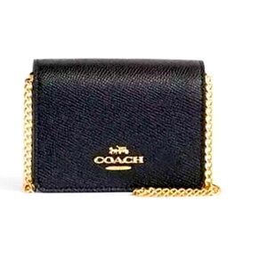 Never used mini black Coach on chain (original chain.)
